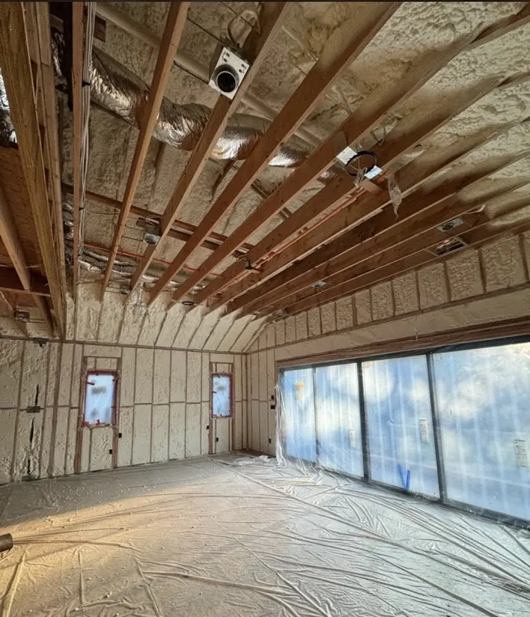 Interior walls and ceiling insulated with spray foam during new construction in Jacinto City